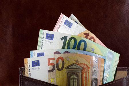 European Union bills slid out of the wallet. Euro notes are not made of paper, but of pure cotton fiber to improve their durability.の写真素材