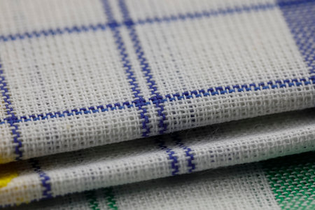 A group of new, unused colored napkins or kitchen towels for daily home use in the kitchen or on a...