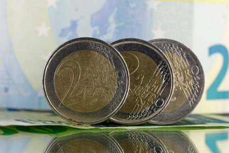 The currency of the European Union is visible here, there are coins and there is paper money in the background. Coins and banknotes can be used as illustrations for many various financial issues.の写真素材