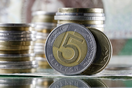 These are Polish zloty coins, with Polish paper money in the background. This image provides illustrations for many various financial matters. PLN currencyの写真素材