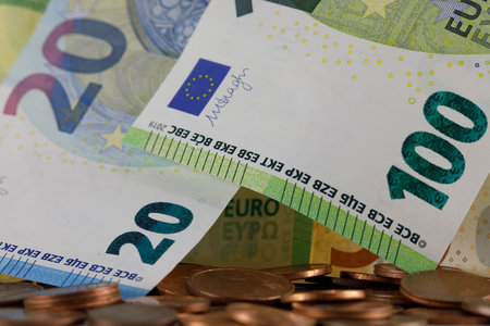 The currency of the European Union is visible here, there is paper money and there are small coins. Banknotes and coins can be used as illustrations for many various financial topics.の写真素材