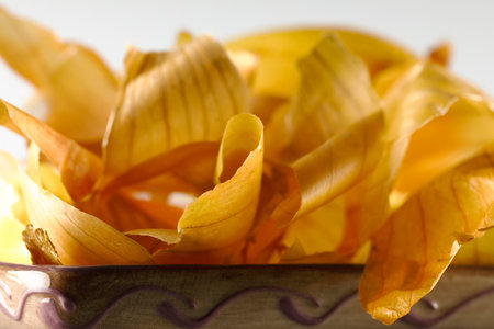 There were only pieces of peel left on the heap after peeling the onionの写真素材