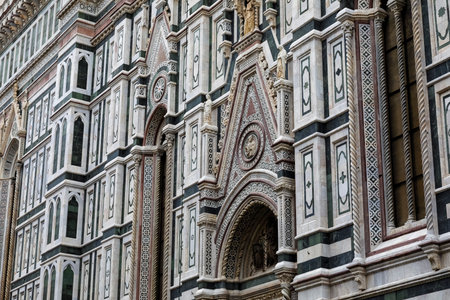 An architectural fragment of the majestic building of the Cathedral of Santa Maria Del Fiore, which is an undisputed masterpiece of sacred architecture on a global scale. Florence, Italy.の写真素材
