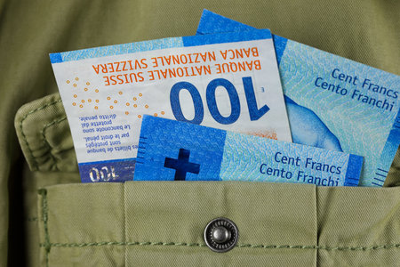 Banknotes sticking out of a jacket pocket. This theme can be used to illustrate a wide range of financial topics. Swiss franc currency, CHFの写真素材