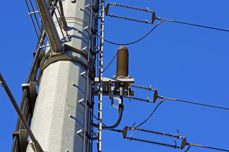 Detail of the pylon of the overhead power line, forming the industrial backdrop here. Warsaw, Polandの写真素材
