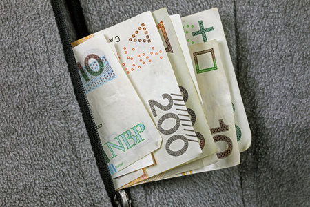 A pocket with banknotes sticking out. This theme can be used to illustrate a wide range of financial topics.の写真素材