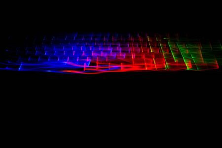 Abstract overlay of color trails keyboardの写真素材