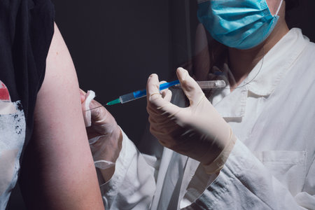 People getting covid-19 vaccine close upのeditorial素材