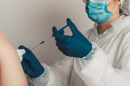 vaccine in hands of a doctorの写真素材