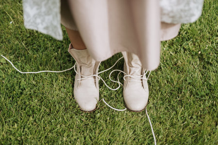 untied Women's Shoes laces white on grassの写真素材