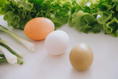 eggs and salad and garlic leaf on the tableの写真素材