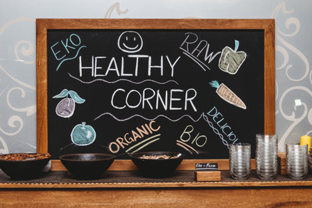 Healthy lifestyle concept. Chalkboard with healthy food icons on tableの写真素材