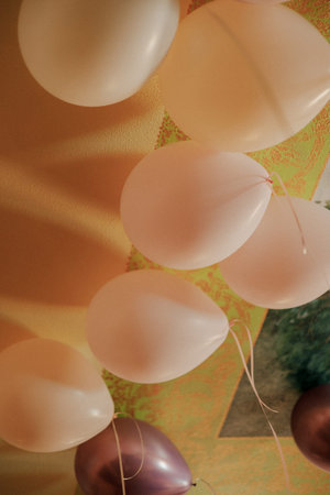 Colorful balloons decorated for celebration on a vibrant background creating a festive atmosphereの写真素材