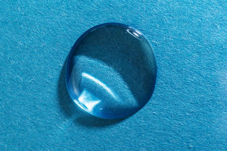 The gel flows over a blue fluted backgroundの写真素材