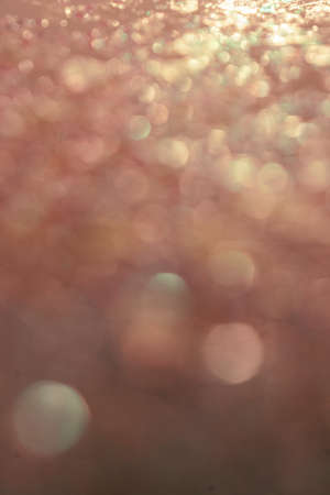 Gold abstract glitter background with shiny bokehの写真素材