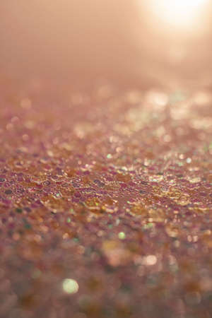 Gold abstract glitter background with shiny bokehの写真素材