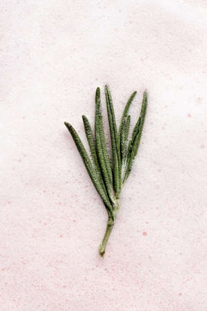 The texture of soap foam with bubbles on a pink background.の写真素材