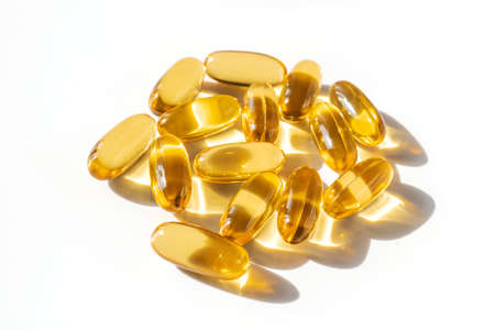 Oil filled capsules on the white backgroundの写真素材