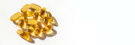 Oil filled capsules on the white backgroundの写真素材