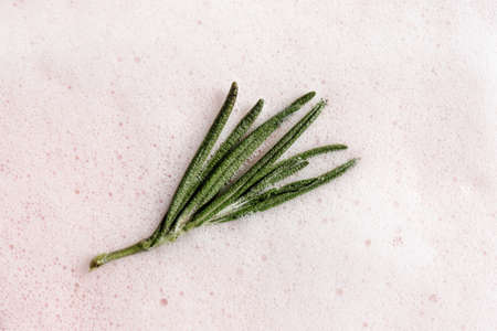 The texture of soap foam with bubbles on a pink background.の写真素材