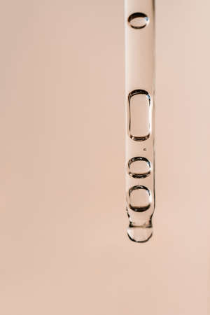 Cosmetic product in a pipette with bubbles.
