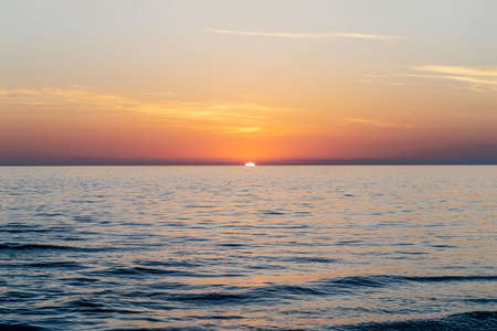 Beautiful sunset landscape on the blue sea.の写真素材