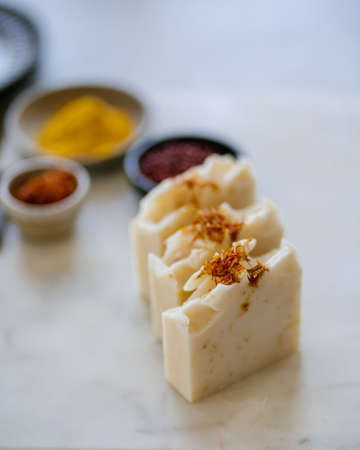 Natural soap lies on the marble surface.の写真素材