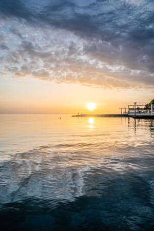 Beautiful sunset landscape on the blue sea.の写真素材