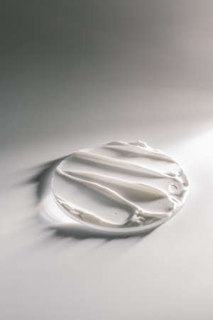 White cream texture on a white background.