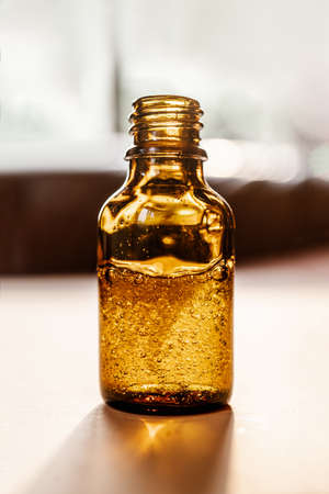 Pipette with cosmetic oil in a brown bottle with bubblesの写真素材
