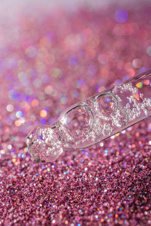 A drop of cosmetic oil falls from the pipetteの写真素材