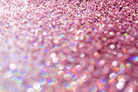 Abstract sequin background with shining festive bokeh.の写真素材