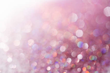 Abstract sequin background with shining festive bokeh.の写真素材