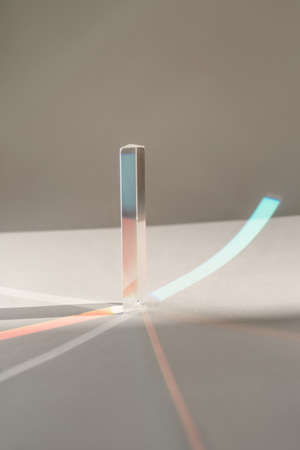Transparent crystal prism on a white background.