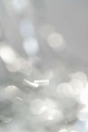 Abstract atmospheric background of tinsel with bokeh.の写真素材