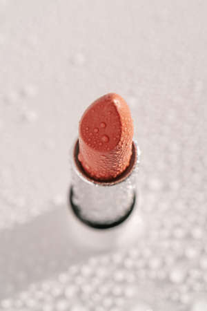 Moisturizing lipstick with water drops on it.の写真素材