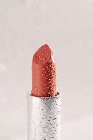 Moisturizing lipstick with water drops on it.の写真素材