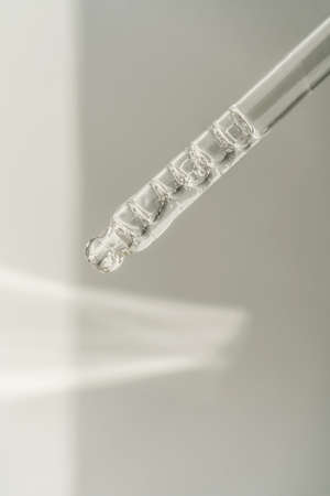 Pipette with bubbles on a white background.の写真素材