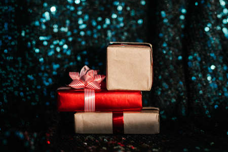 Red and craft gifts on the emerald background.の写真素材