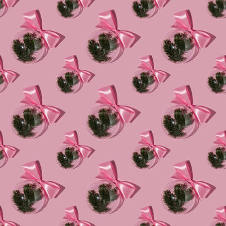 A balloon with a Christmas branch on a pink background. Pattern.