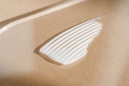 White cream texture on a beige background.の写真素材