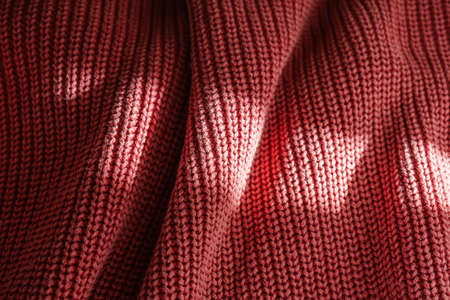Knitted texture of a pink sweater or scarf close-up.の写真素材