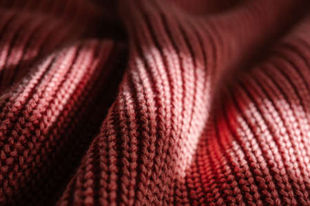 Knitted texture of a pink sweater or scarf close-up.の写真素材