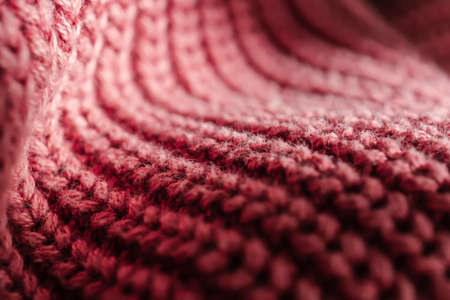 Knitted texture of a pink sweater or scarf close-up.の写真素材
