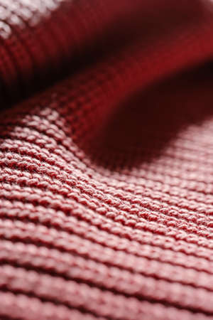 Knitted texture of a pink sweater or scarf close-up.の写真素材