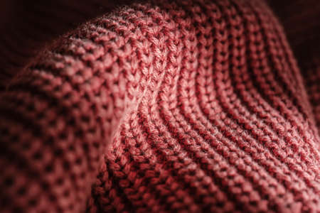 Knitted texture of a pink sweater or scarf close-up.の写真素材