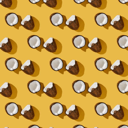 A pattern of coconuts on a bright yellow background.の写真素材