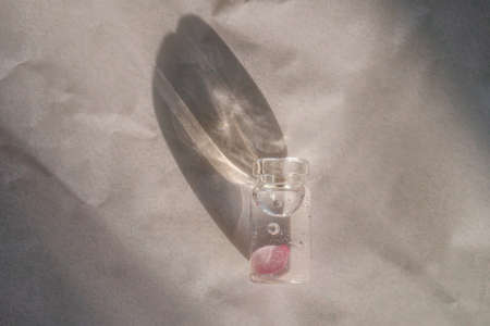 A bottle of cosmetic gel on a pink background.の写真素材