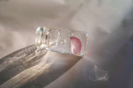 A bottle of cosmetic gel on a pink background.の写真素材