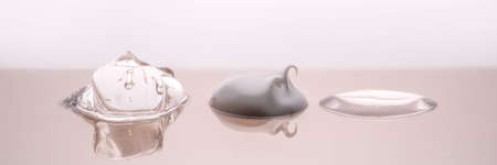 Cream, hyaluronic gel and serum on a beige background.